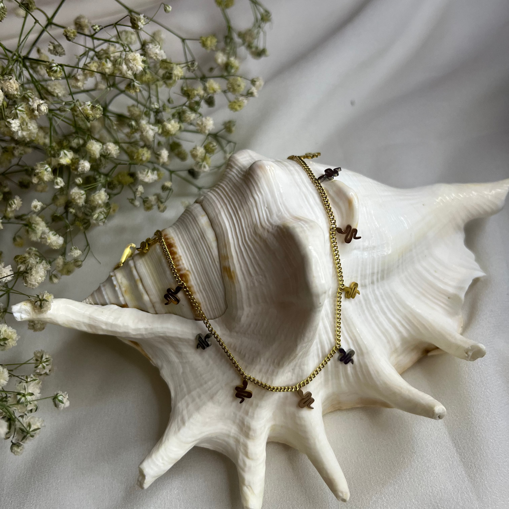 GOLDEN SERPENT CHARM NECKLACE